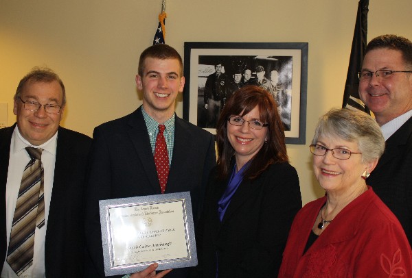 In February, Francis Mazzocchi (l), chapter vice president for scholarships, presents the General Emmett Paige Scholarship for $2,000 to Jacob Amsbaugh (2nd from l), Georgia Institute of Technology, while his parents Stacy (c) and Mike and his grandmother Naomi look on.